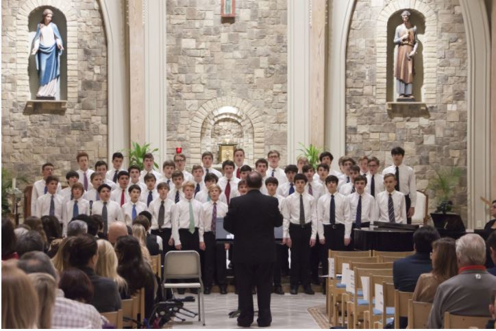 Mr. Tim Johnson conducts the Advanced Boys Chorus performing at the 2019 Sacred Concert.