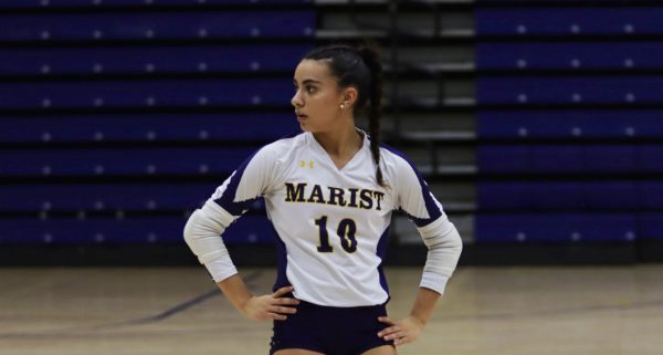 Maya Warrier, one of the varsity volleyball War Eagles, sets her attention on winning the next game.
