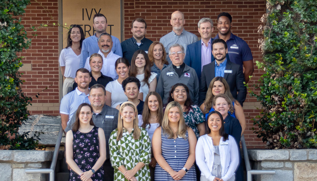 The 2023-24 cohort of new faculty and staff members pose for a photo outside Ivey. Each one, in their own way, came to our school to make it a better place.