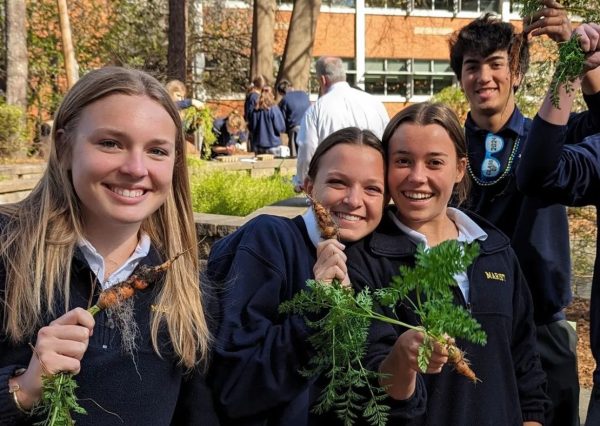 Members of the Gardening class harvest the last few carrots from the fall planting. Soon, the spring planting will take place and the cycle will begin anew.