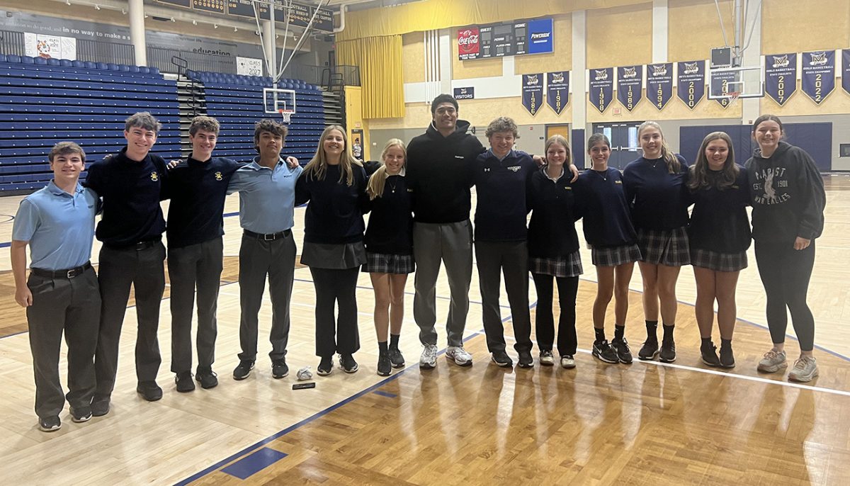 FCA officers pose for a quick photo with Kyle Hamilton, one of the many great speakers who agreed to share his faith journey during a Friday morning meeting.