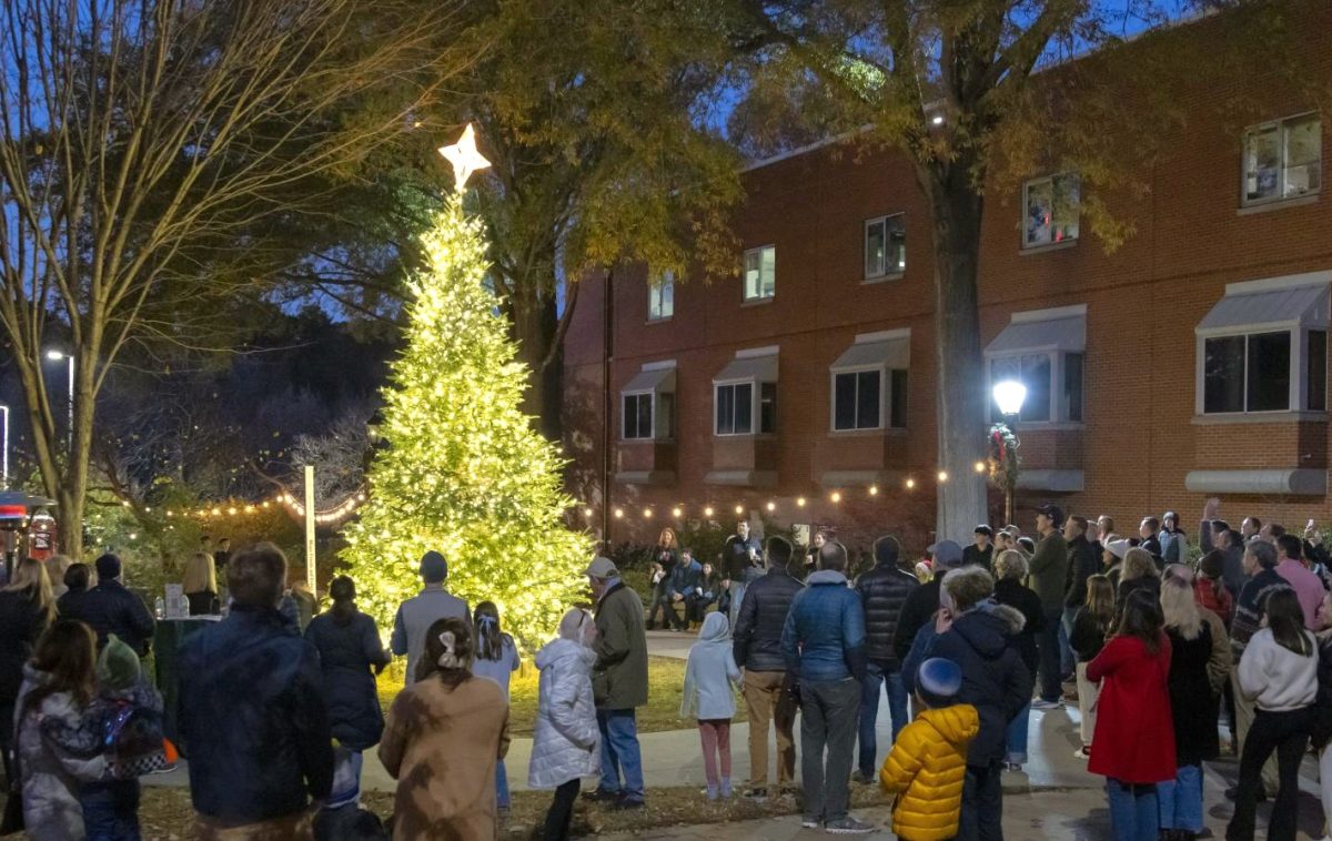 At our school’s first Christmas tree lighting, alumni and current families gather around the tree to admire the bright lights.