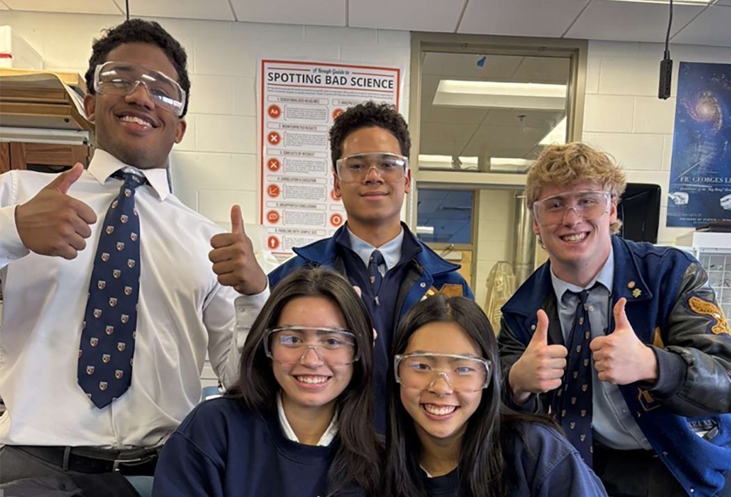 Donning proper safety goggles, AP Science students give lab a big thumbs up. (Photographer: Cosette Lane)