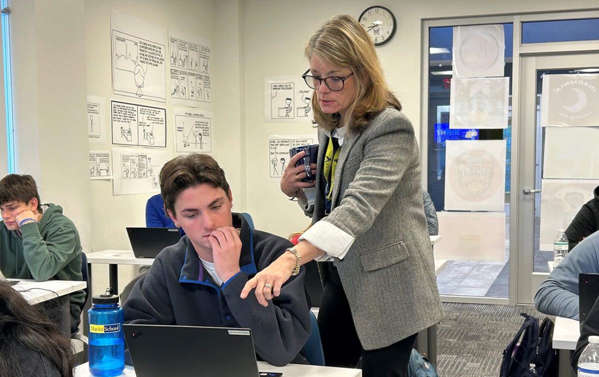 Dr. Priestley helps a student during one of the several classes she teaches in the Business, Computer Science, and Engineering Department.