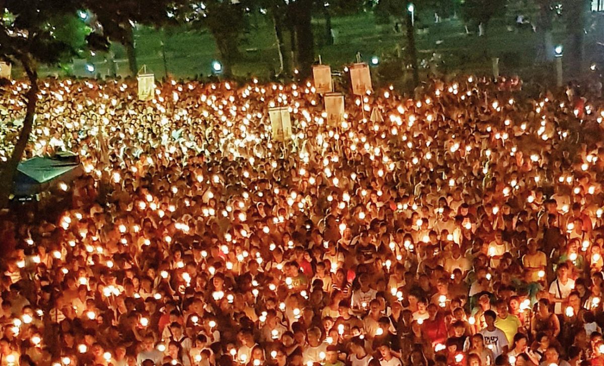 In the Philippines, Holy Week is marked by massive candlelit processions through crowded streets. (Photo Credit: Fundacja Kahibalo)