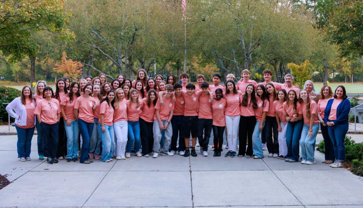 Everyone who participated in the Barcelona exchange – including visitors, hosts, teachers, and administrators – pose for a picture to remember the occasion. (Photographer: Brian Collier) 