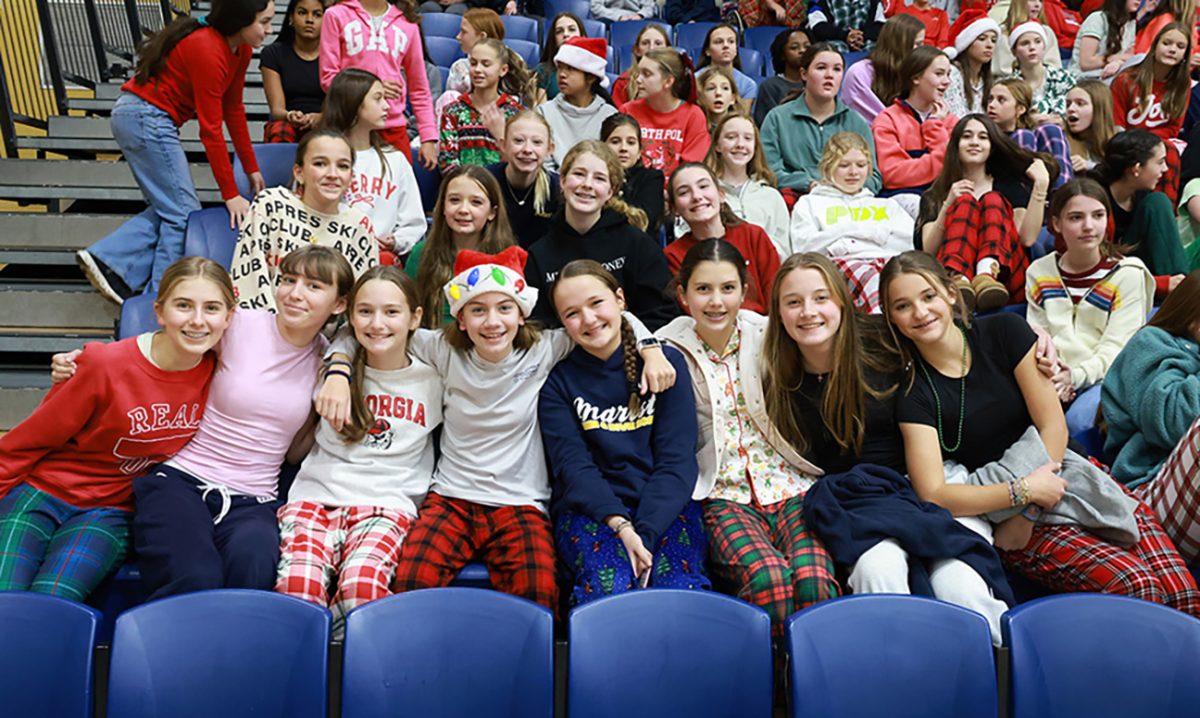 Foundation students gather together to start the holidays with a cheer during the schoolwide Christmas assembly. (Photographer: Brian Collier)