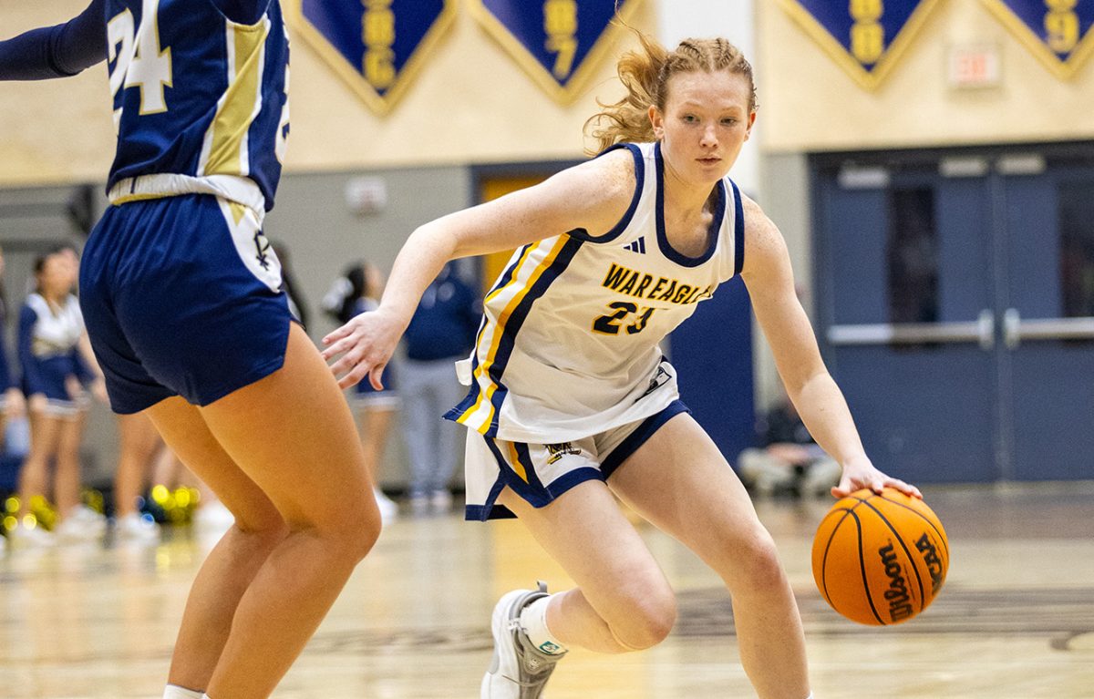 Emily Morrison takes on the St. Pius X defender on her way to the basket. (Art of Life Photography)