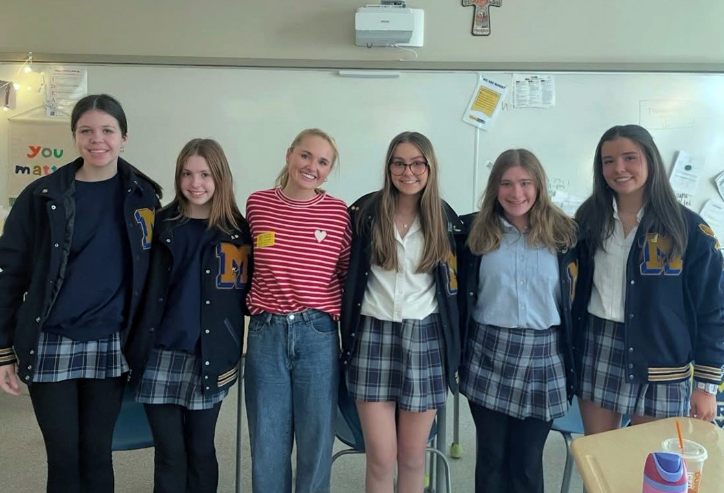 Several members of the Girls for Girls club pose for a pictures with a recent guest speaker, Annie Mayfield. (Contributed)