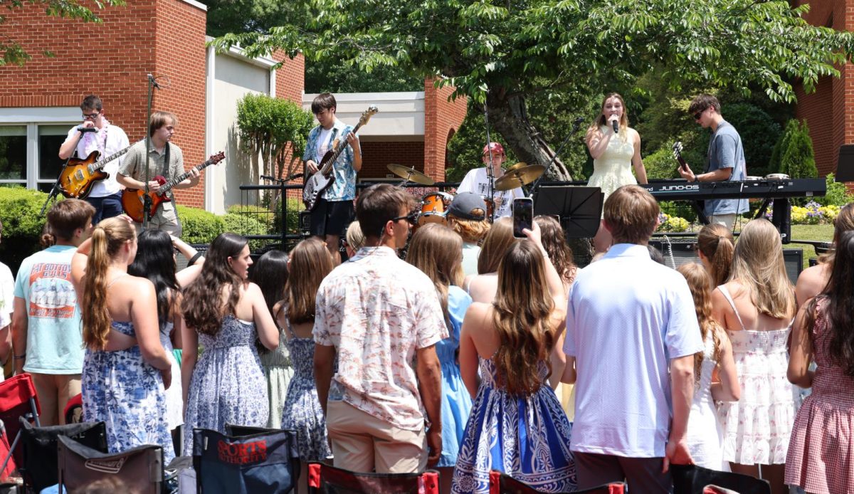 Students enjoy themselves near the flag pole. Chanel Day would not be the same without the music festival atmosphere. (Contributed)
