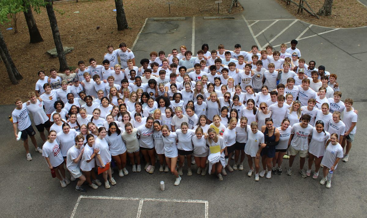 Students gather to take a group photo that demonstrates what the Emmaus retreat is all about. (Pamela Kinsly)