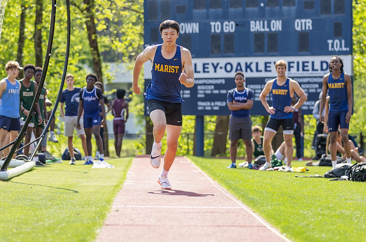 Gian Chung launches himself down the long jump to score some vital points for the team. (©2026Art of Life Photography, Sports Candids)